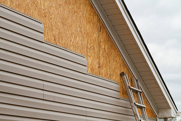 Professional Storm Damage Siding Repair technician working in Unionville, PA
